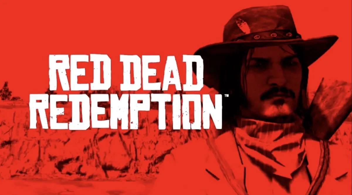 A red and black screenshot from a game featuring the words “RED DEAD REDEMPTION” in large white block letters on the left side. The background shows a rough, western landscape silhouette. To the right is a close-up of Jack Marston, a rugged man with shoulder-length hair, a moustache and goatee, wearing a wide-brimmed cowboy hat and a bandana around his neck, facing forward.