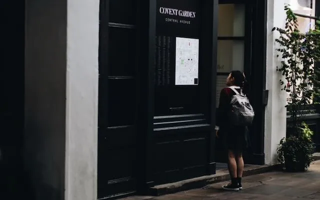 A young girl considers a map