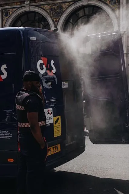 A large amount of smoke comes from the back of a van