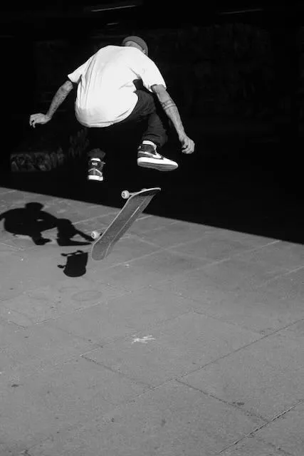 A man does a trick on a skateboard