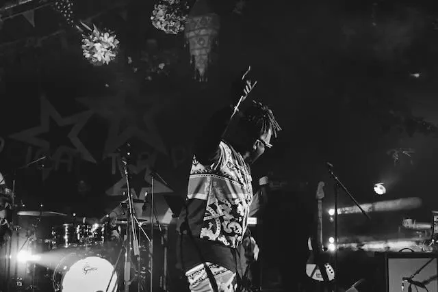 A man on stage hypes up the crowd