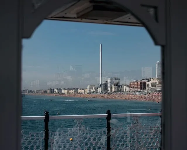 Brighton seen through a glass window on a pier