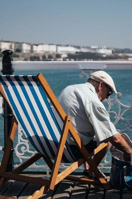 An old man relaxes in a deck chair