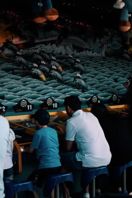 A man and a child play a game.