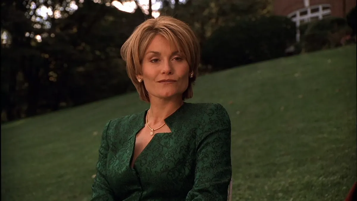 Debbie, giving Tony a knowing smirk.