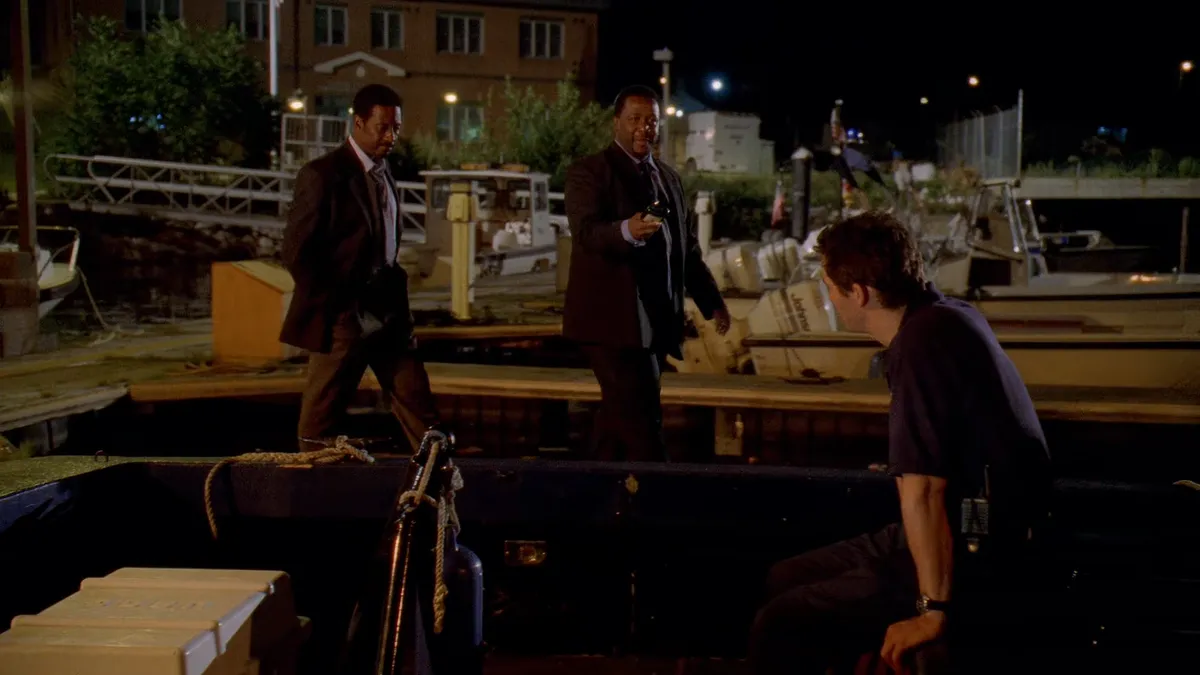 Lester and Bunk visiting McNulty on the docks before he ships out for a shift on the water.