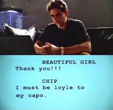 Christopher working on his screenplay, staring at a laptop screen with the dialogue "I must be loyle to my capo" attributed to his protagonist Chip.