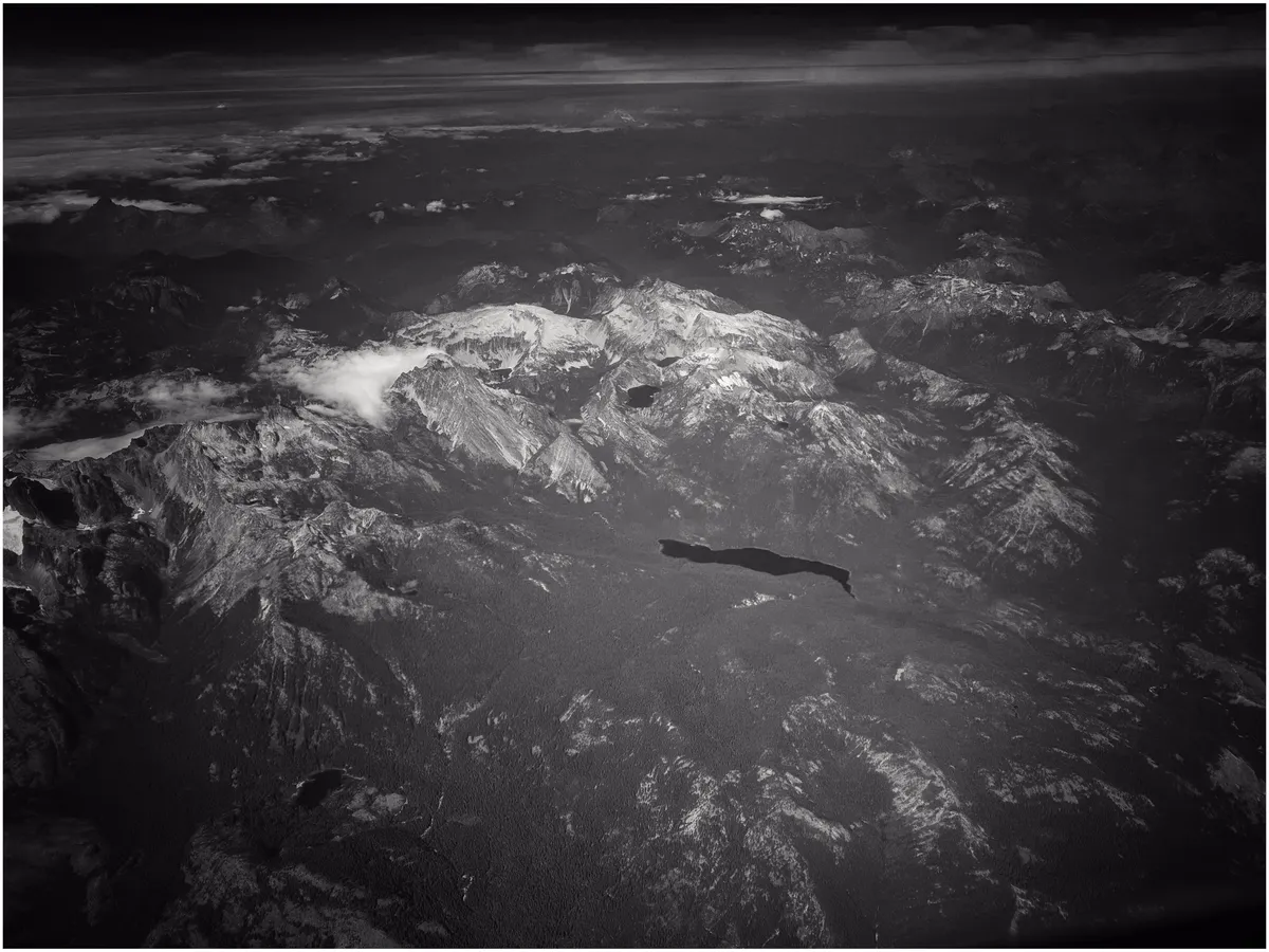 Shot of a lake amidst a mountain basic