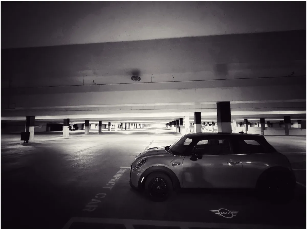 My car in a completely empty parking garage
