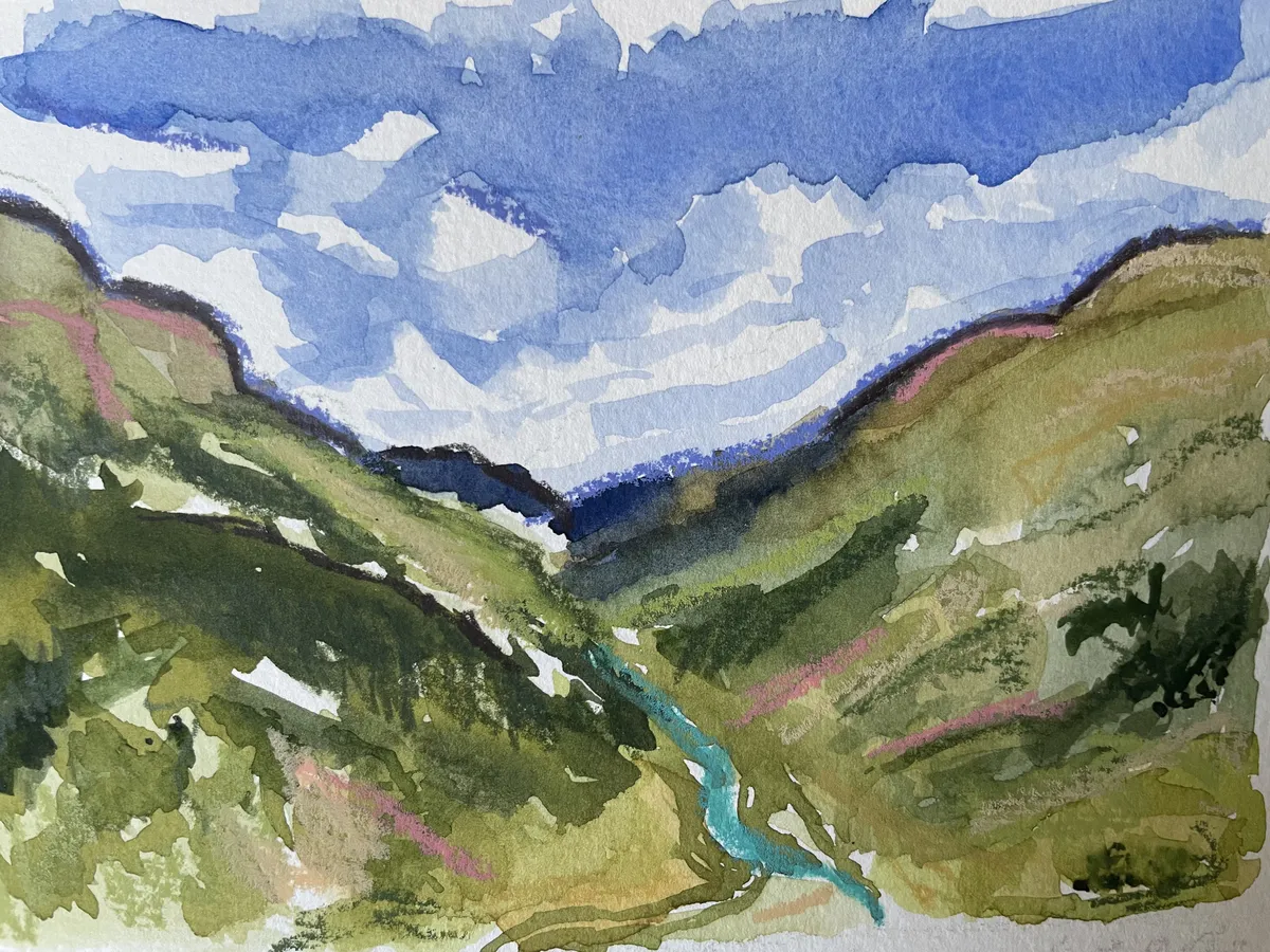 A sketchbook section of a loose watercolor landscape.