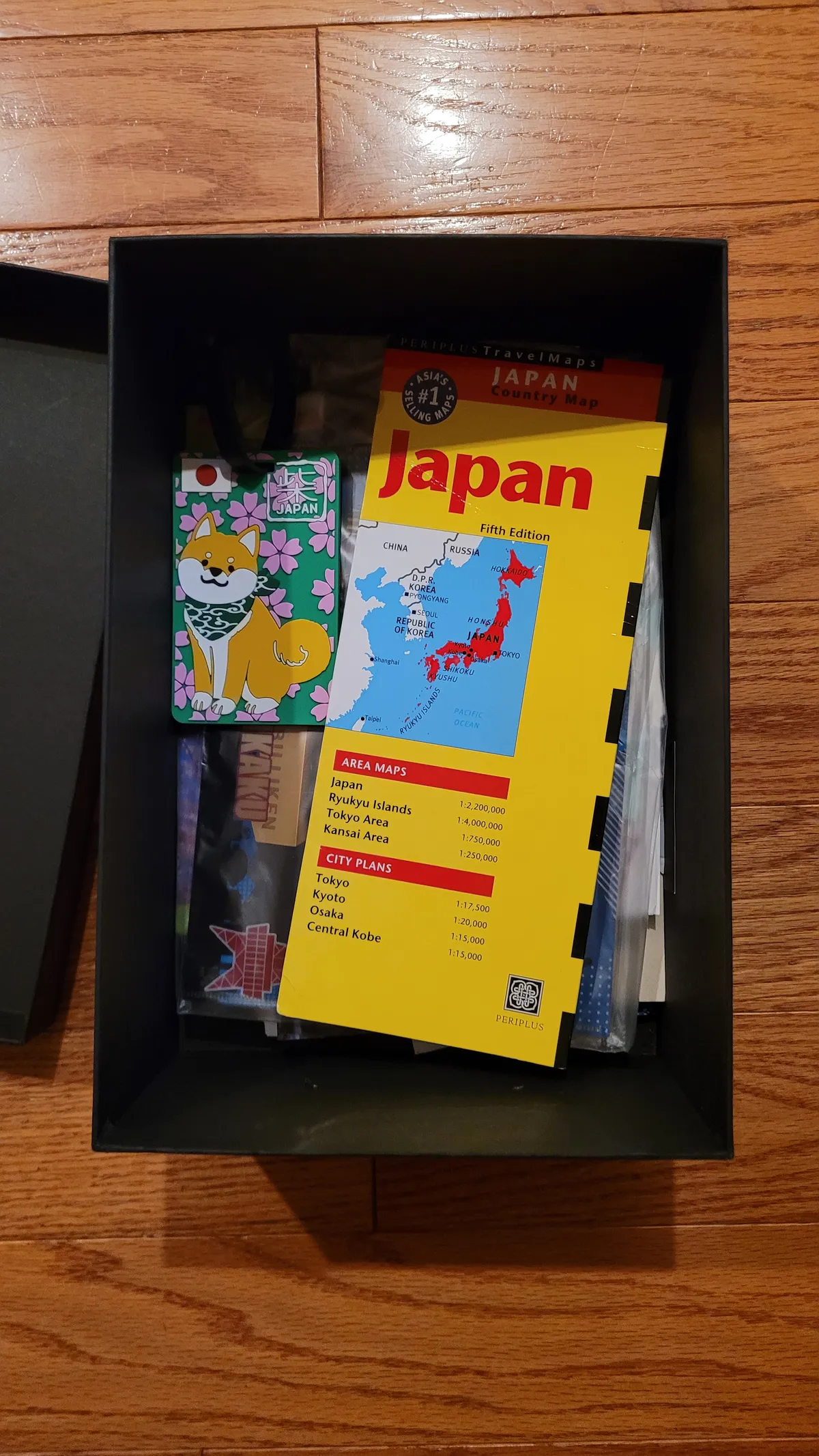 An open shoebox full of Japan paraphernalia