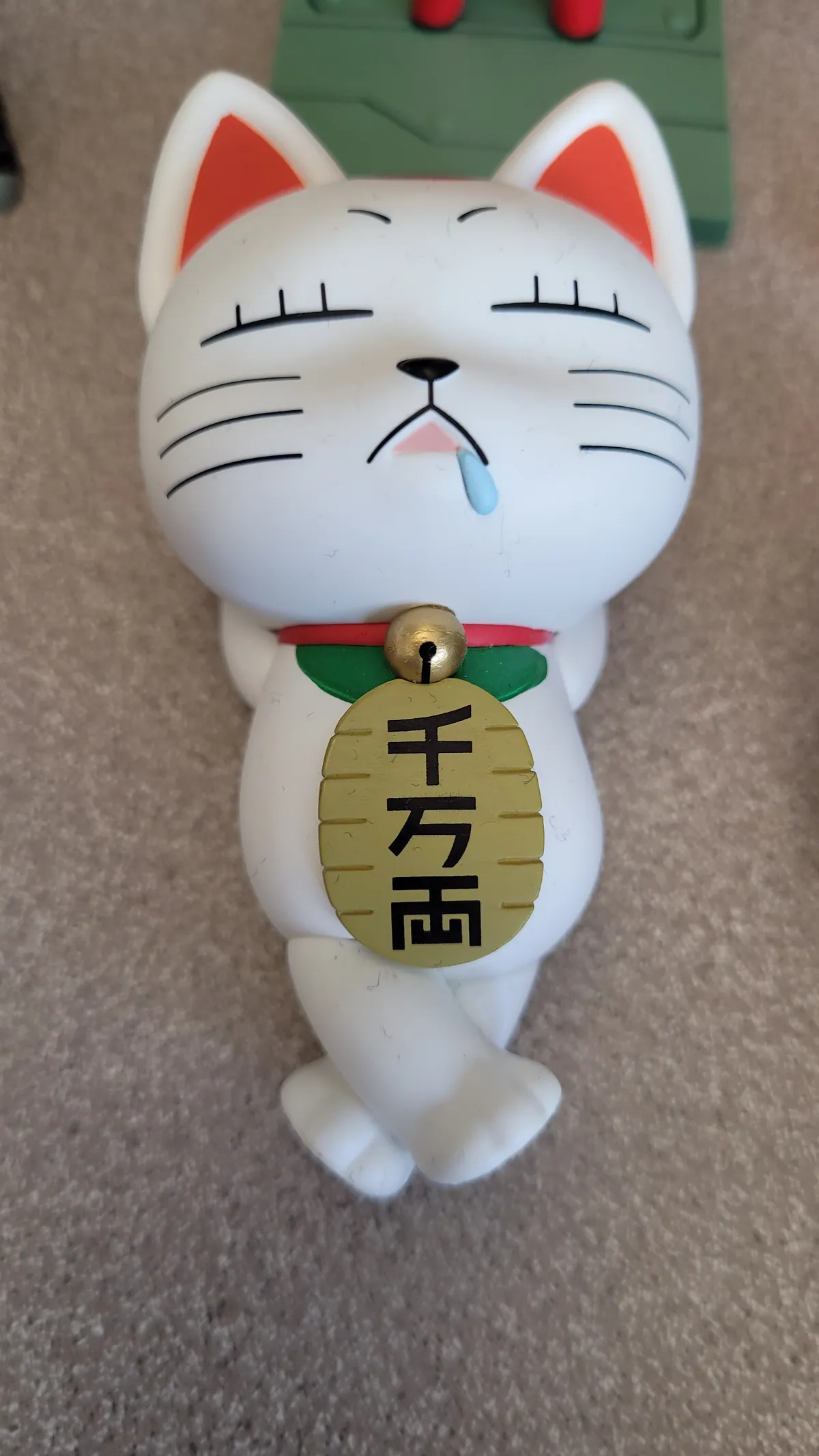Turbo Granny as a lucky cat, sleeping figure