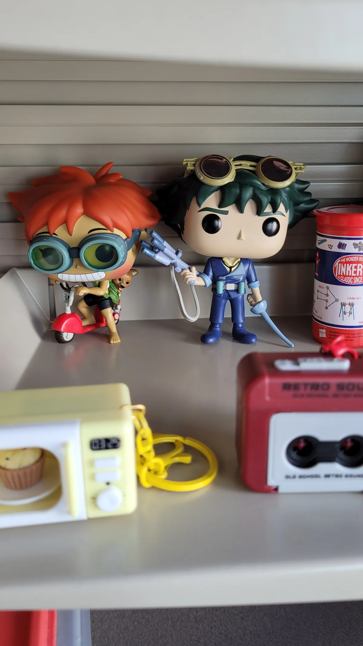Ed and Spike funkos in focus with a mini microwave and mini cassette deck in the foreground
