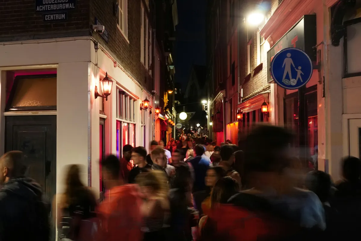 A busy Amsterdam street at night
