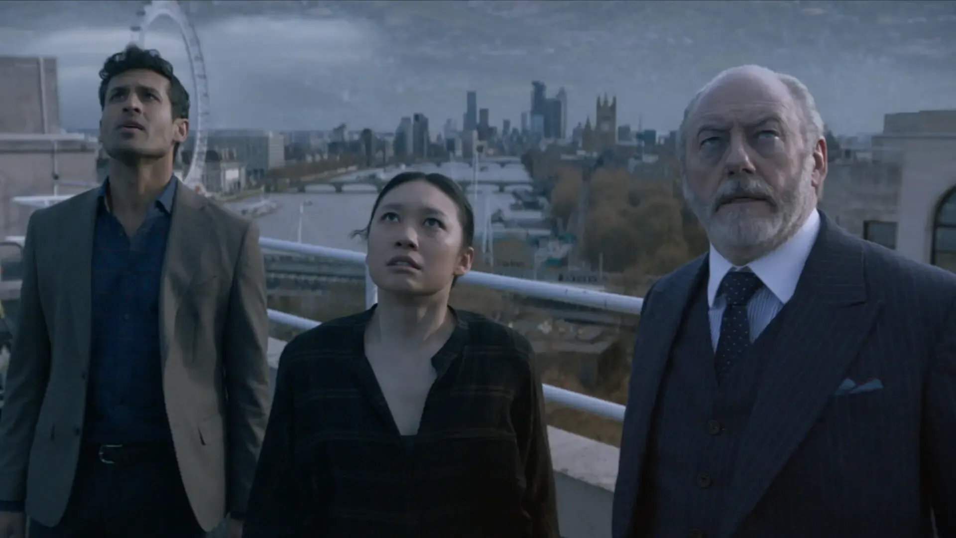 Raj, Jin, and Wade look to the sky as the Sophons announce their presence to the world.