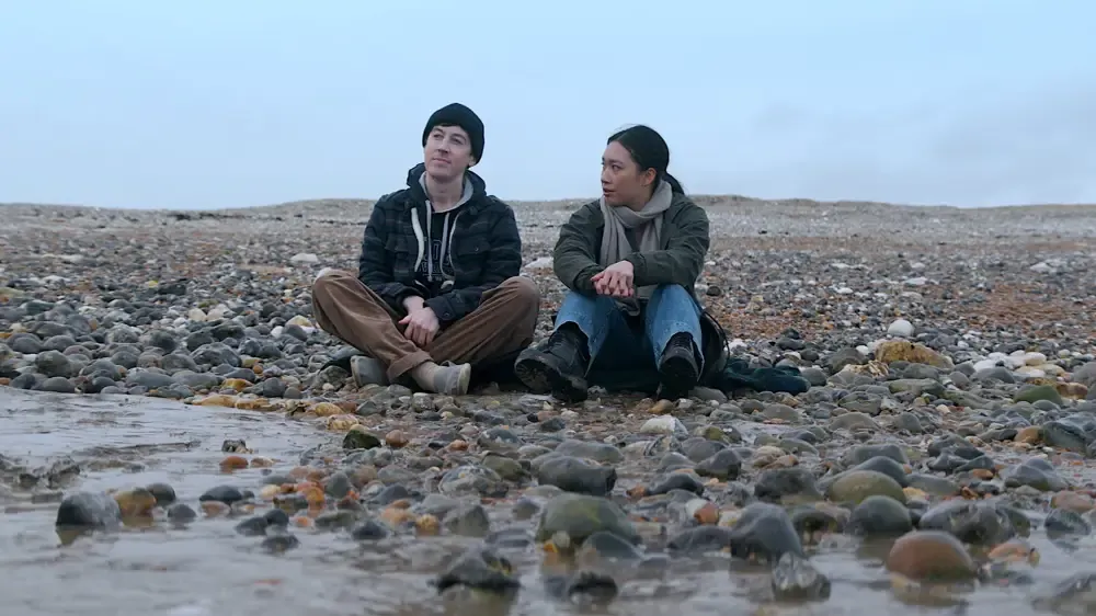 Will and Jin hang out at the shore.