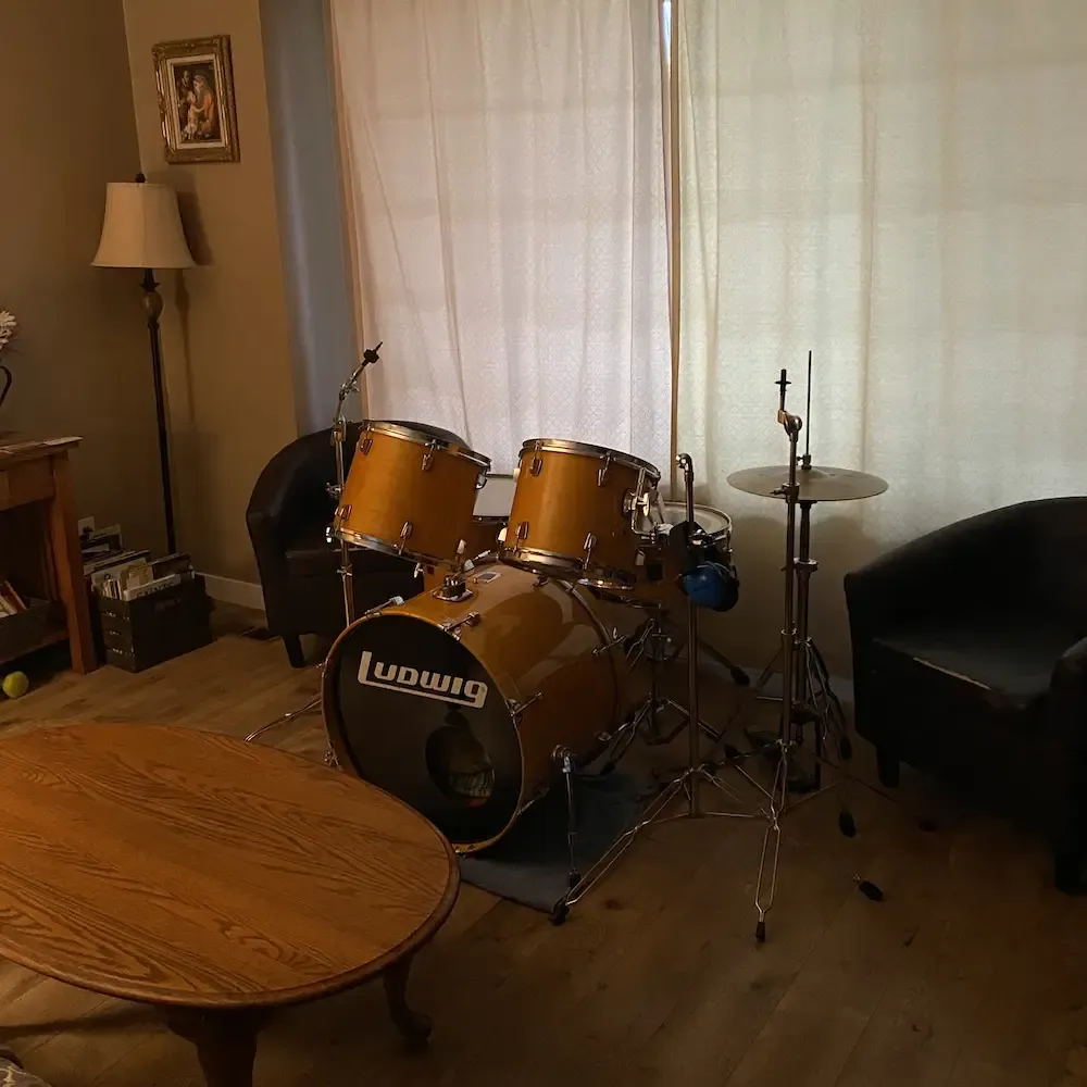 My son's drumset in the middle of the living room.
