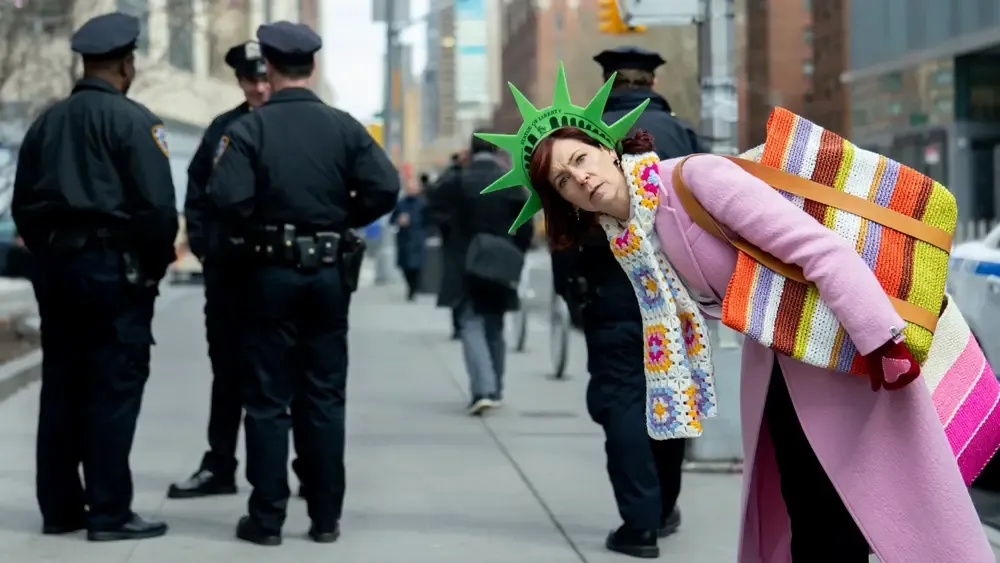 Elsbeth going full tourist with a foam Statue of Liberty tiara.