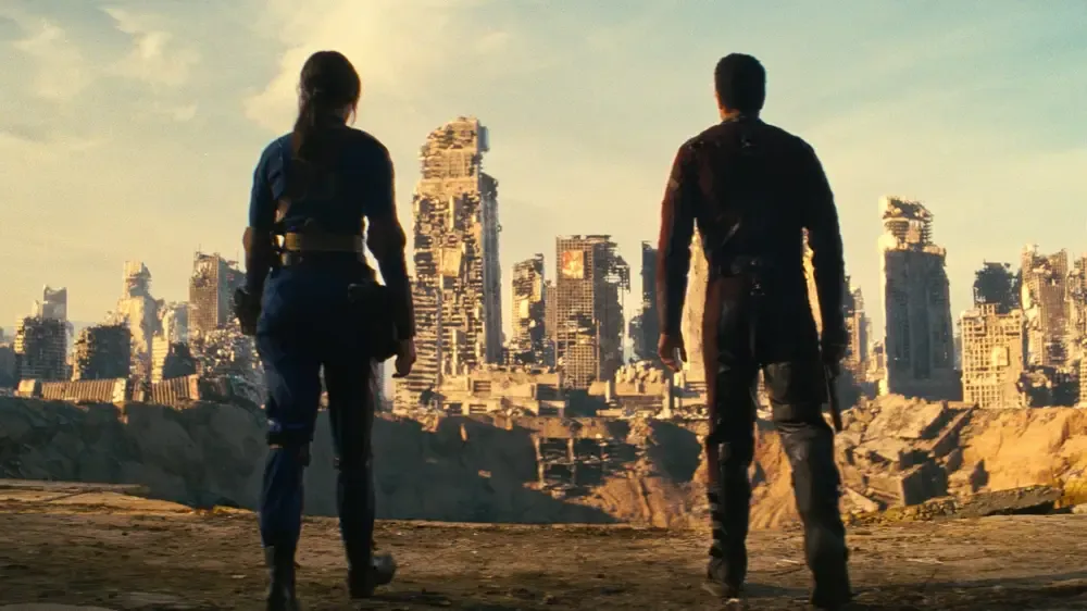 Maximus and Lucy survey the ruins of Shady Sands.