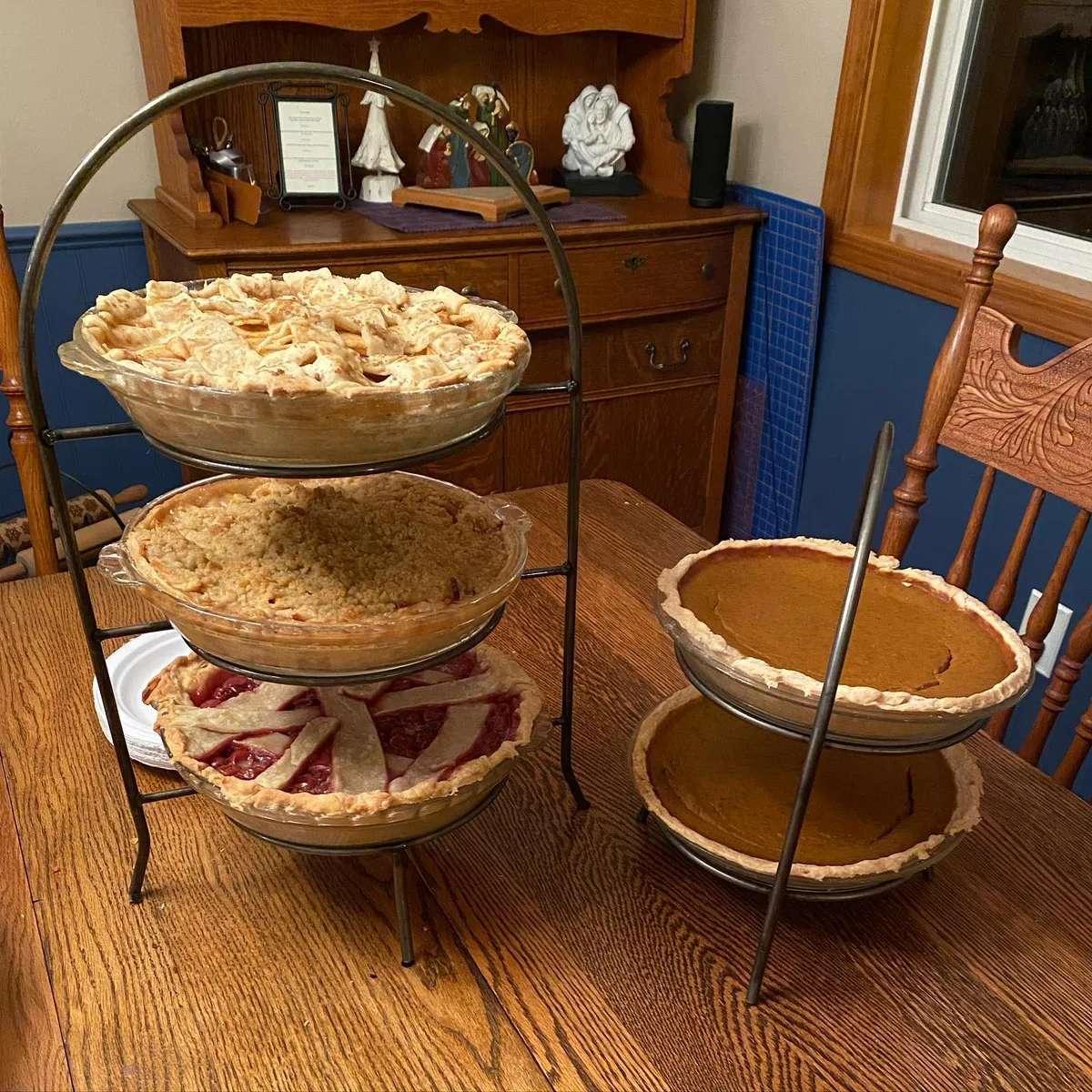 Five pies in two display racks.