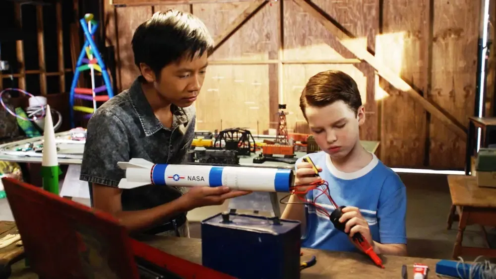 Sheldon and Tam work on a rocket.