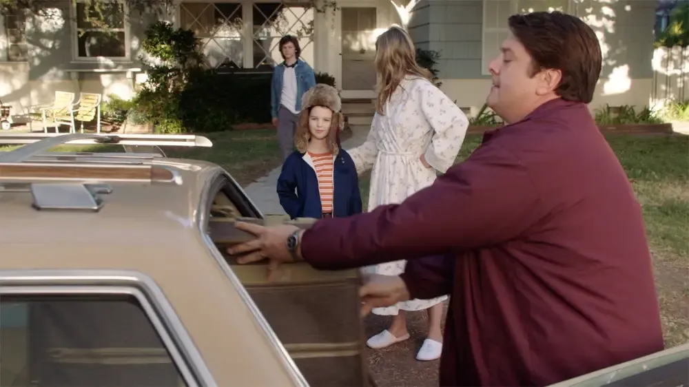 George loads up the station wagon.