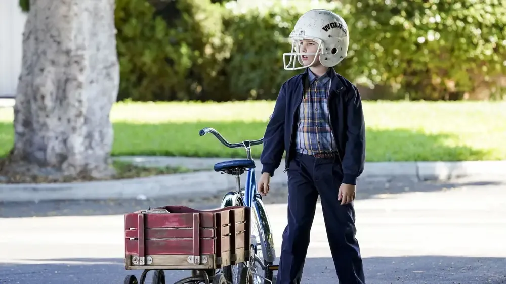 Nice bike helmet! Sheldon the paper boy.