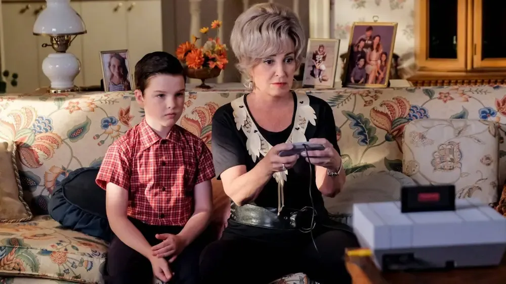 Sheldon and Connie intent on beating the video game.