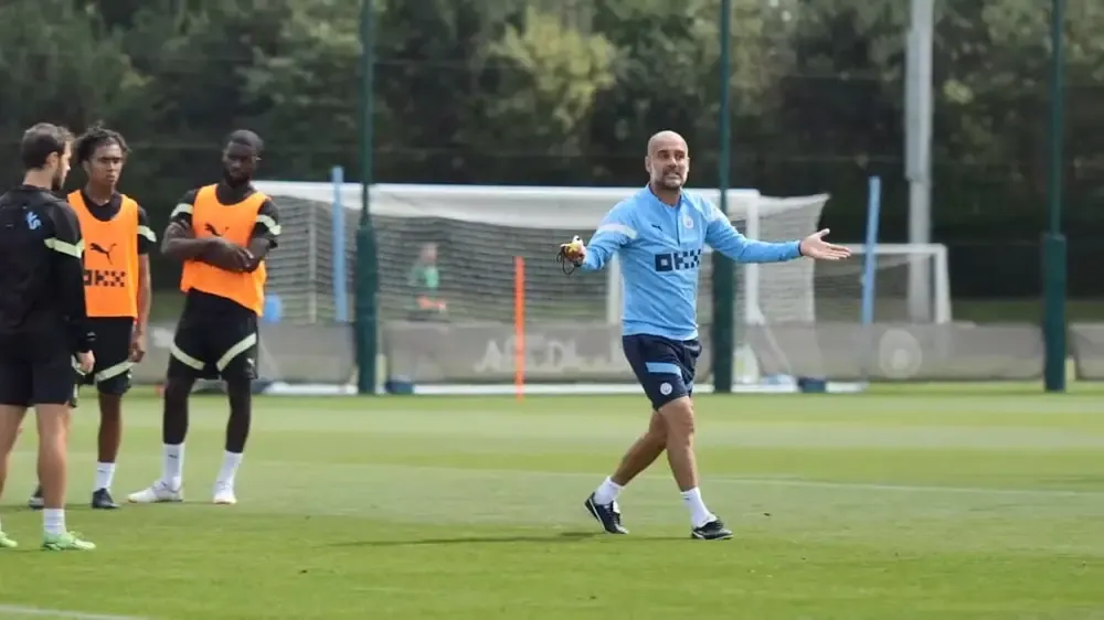 Pep Guardiola runs practice.