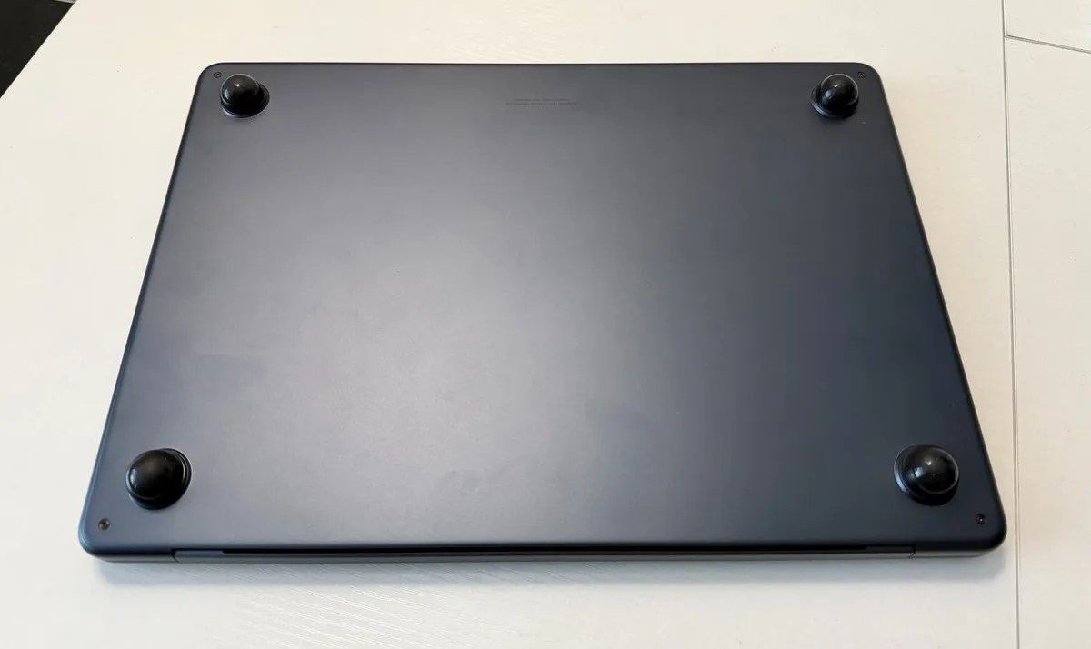 View of all four bumpers attached to the feet of my MacBook Air