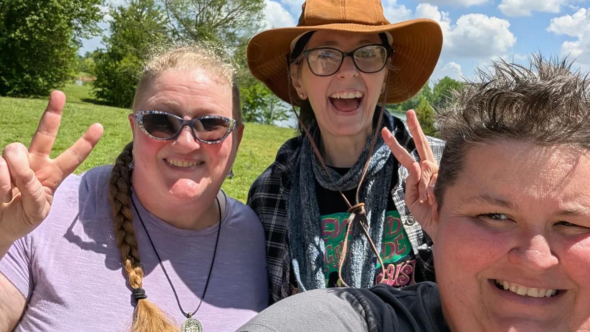 Selfie of three smiling women.