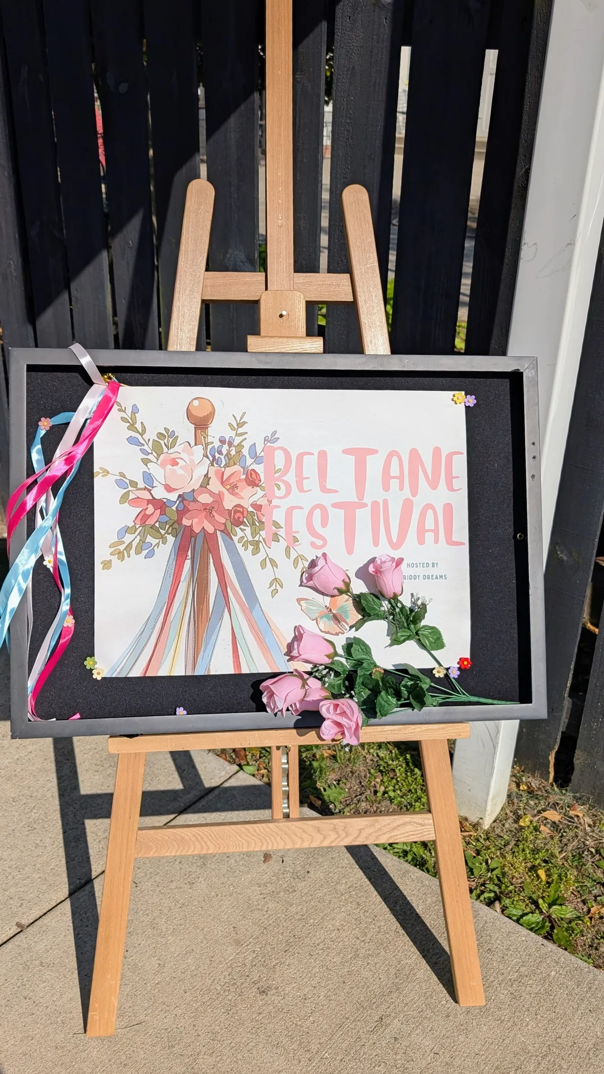 A sign propped against an easel says 