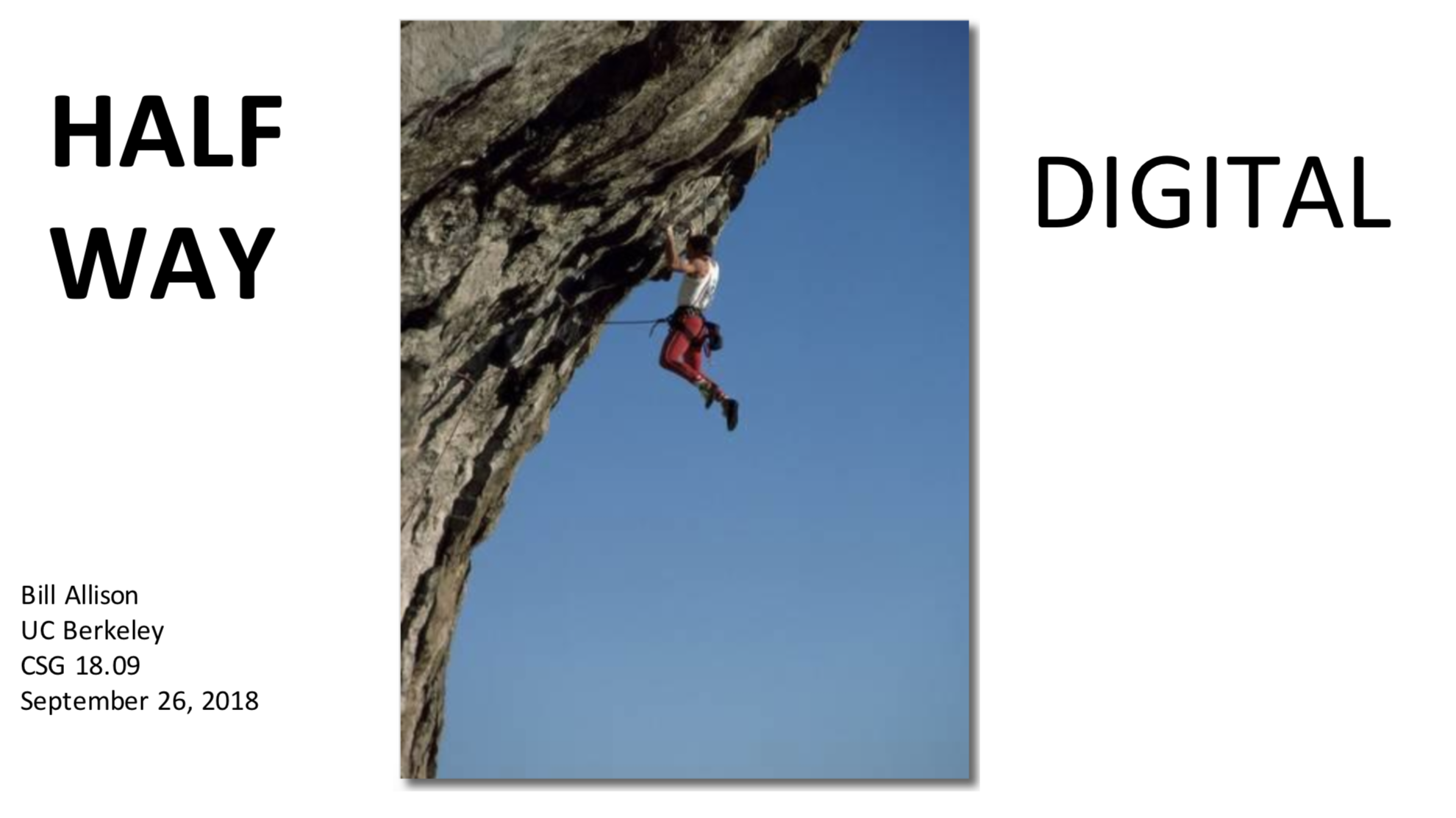 "Climber dangling off a rock face, halfway up"