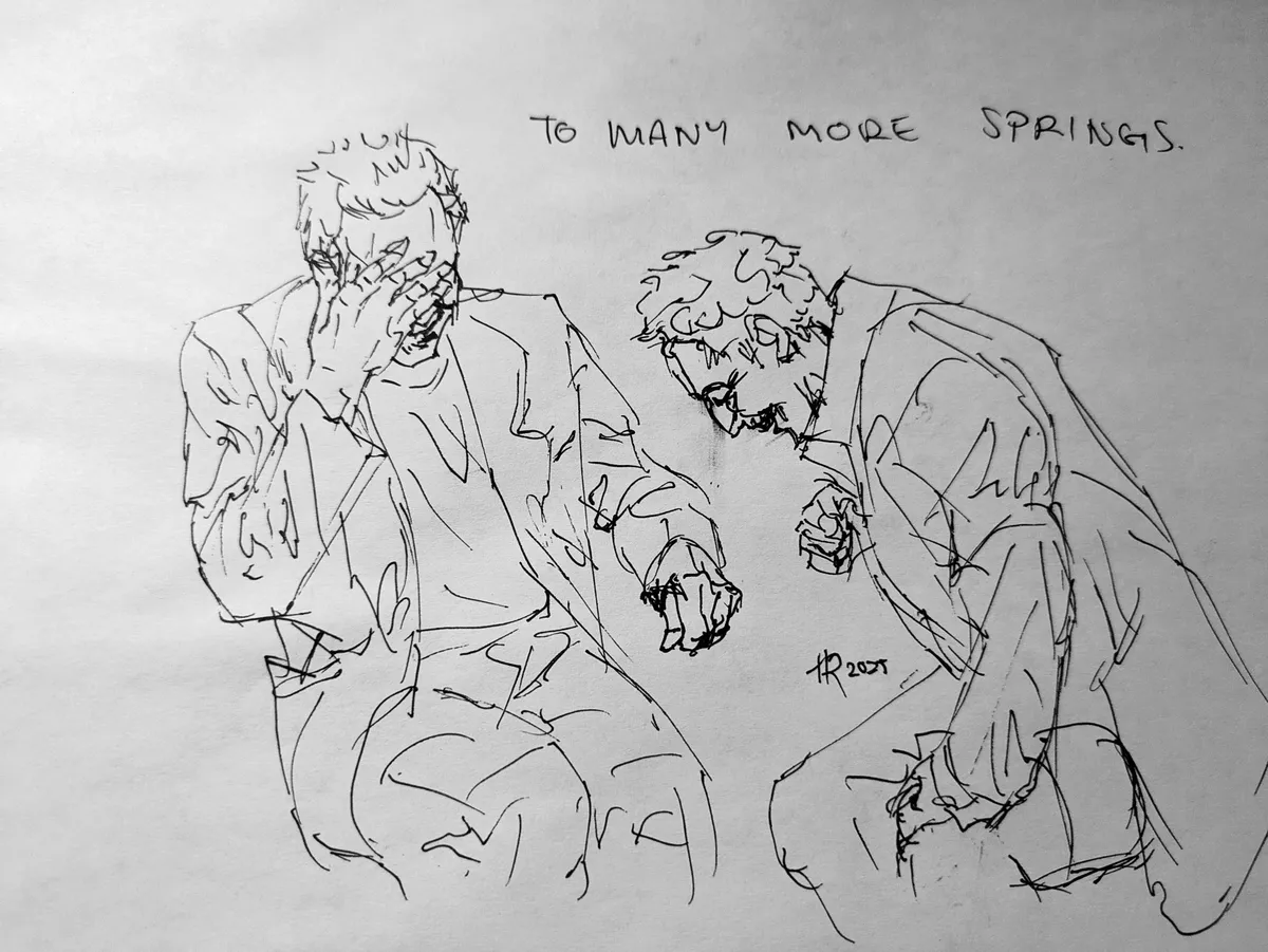 A pen sketch of actors Christopher Walken and John Turturro, two older men, cackling together around a table that has not been drawn. The lines are loose and sharp, trying to capture the motion of laughter. Walken is covering his face but leaving a wide grin visible underneath his palm, while Turturro bends down in a defeated wheeze, crow's feet gathering on the corners of his eyes.