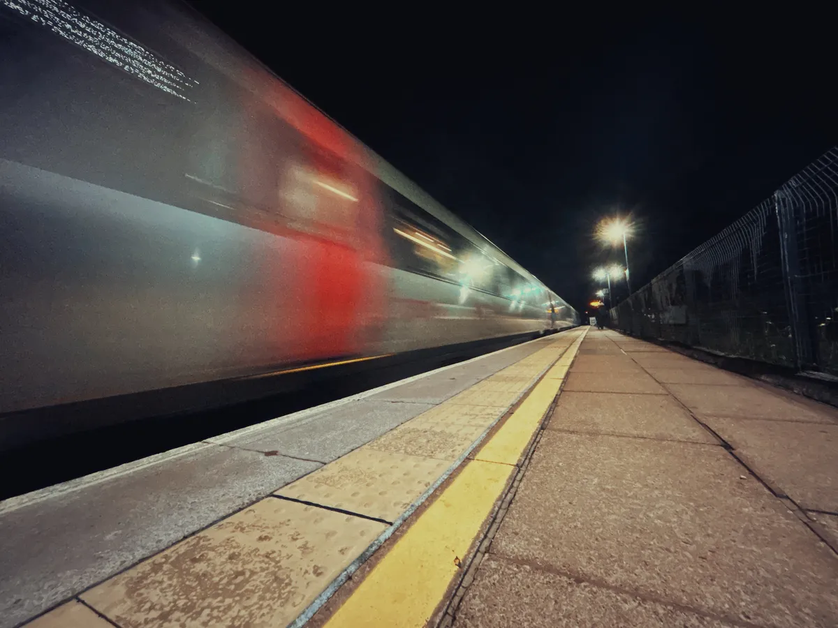 A train speeding past a railway platform