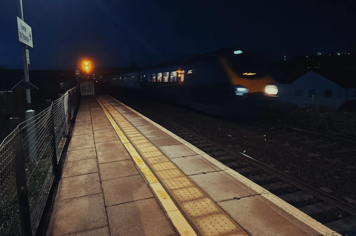 A train speeding through a train station
