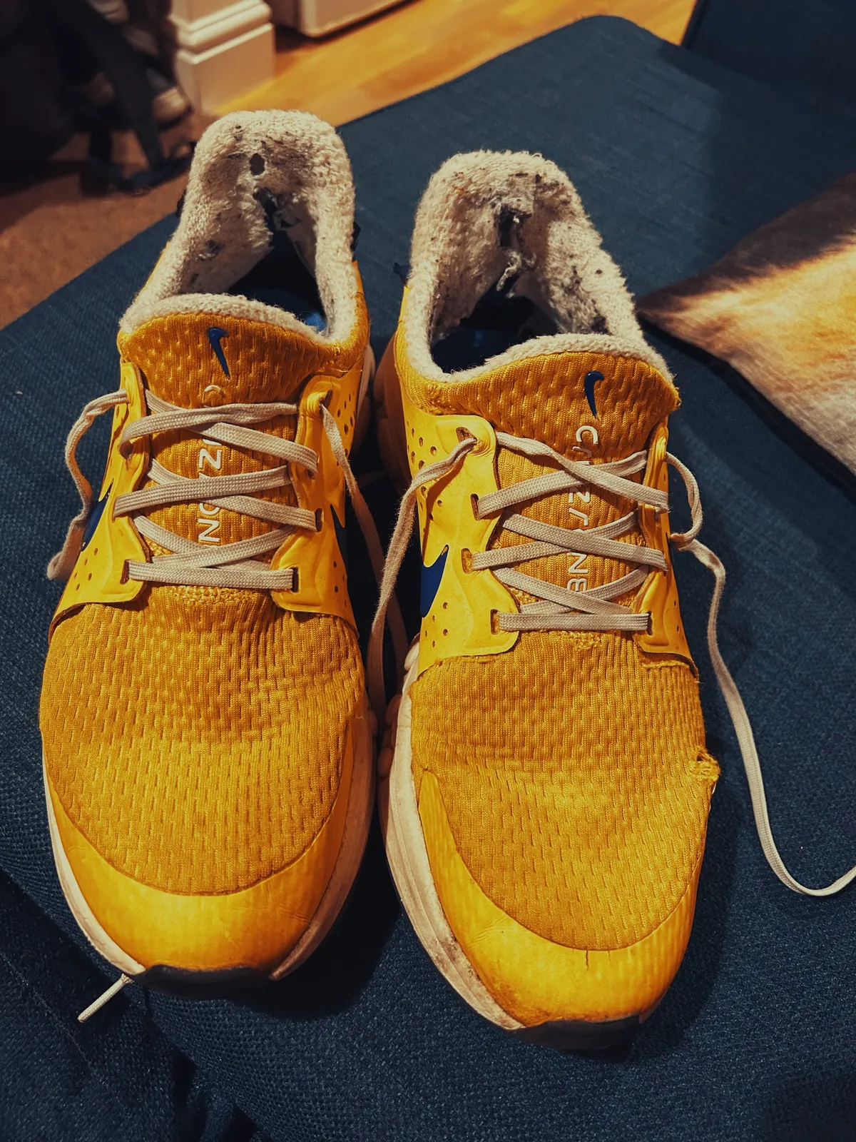 A pair of yellow Nike CruzrOne shoes