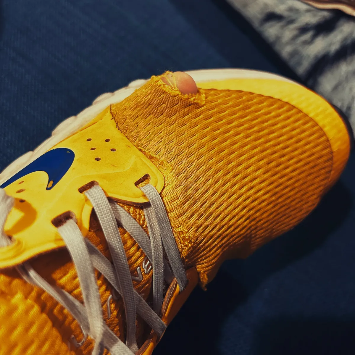 A hole in the toe of a Nike CruzrOne shoe