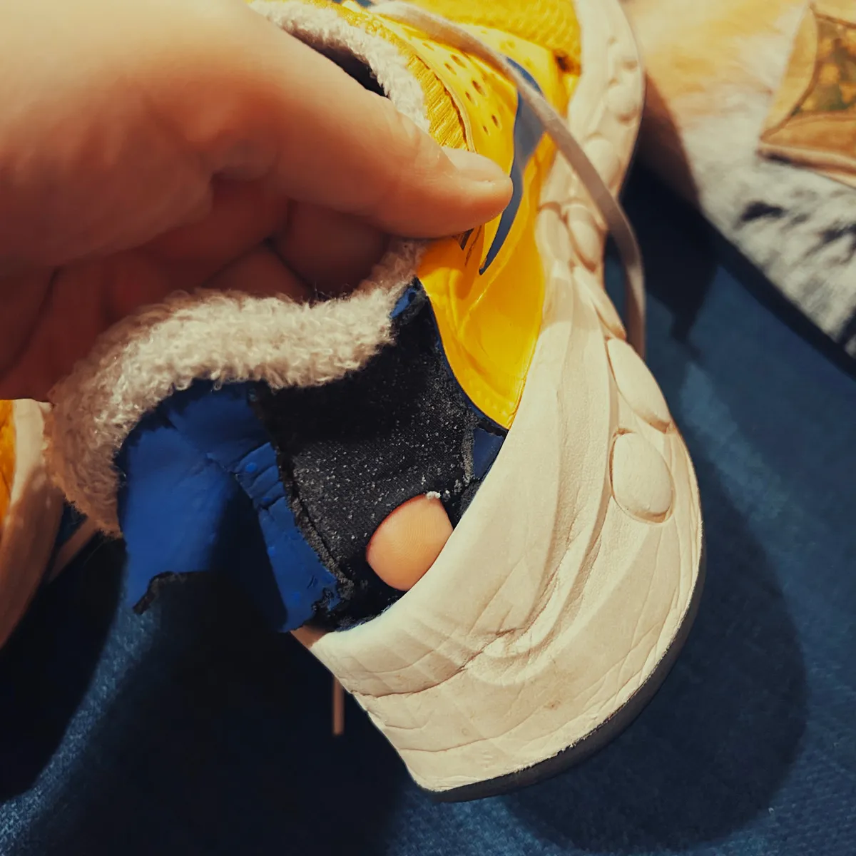 A hole in the heel of a Nike CruzrOne shoe