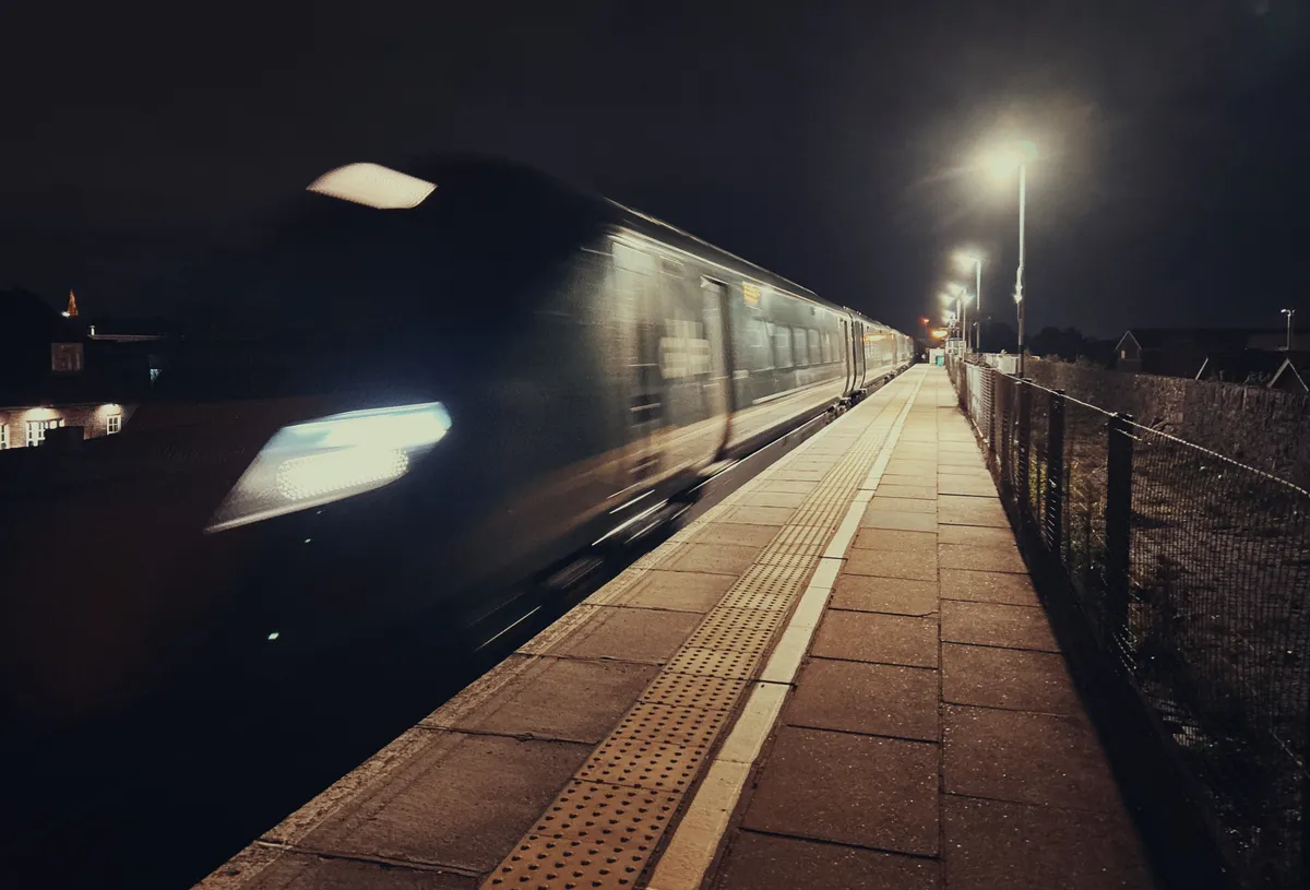 A train speeding through a station