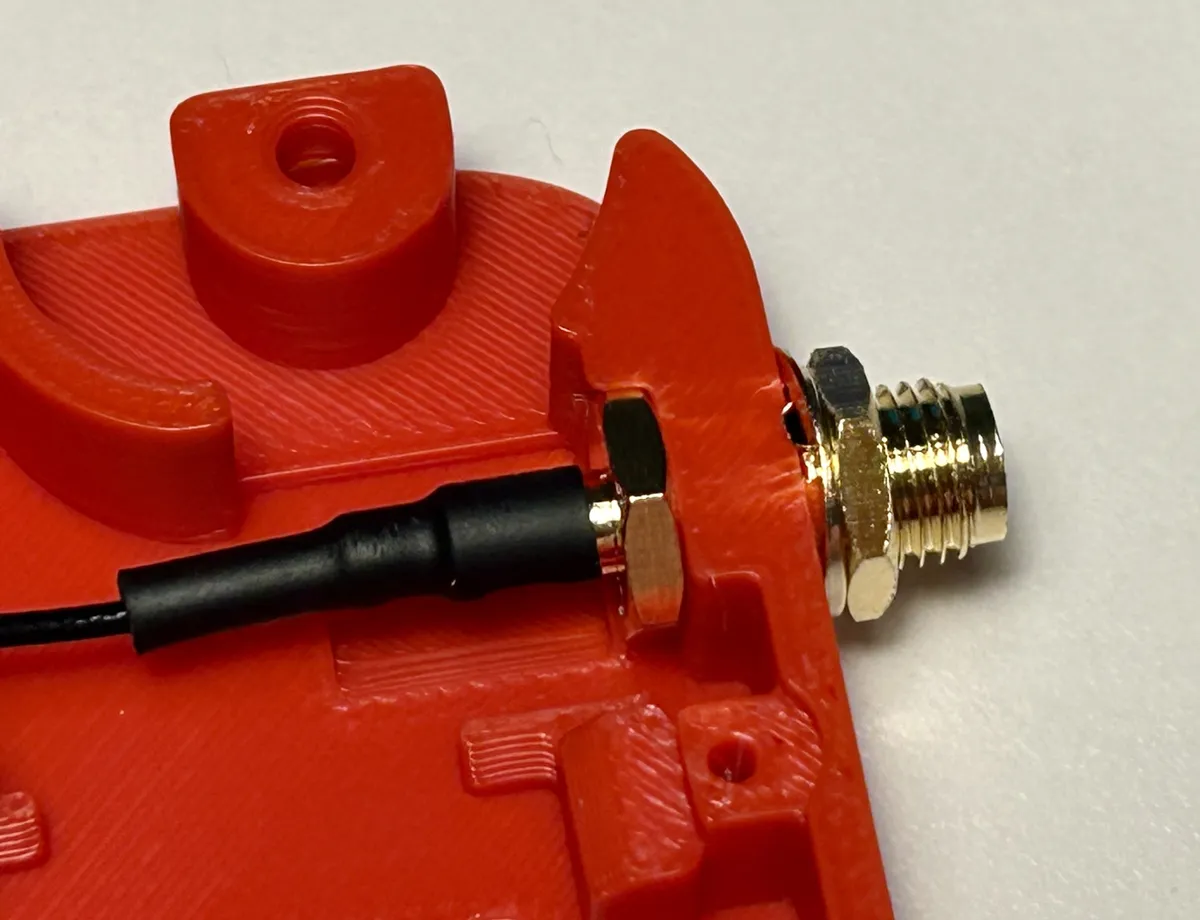 An antenna cable fitted inside a Heltec v3 case