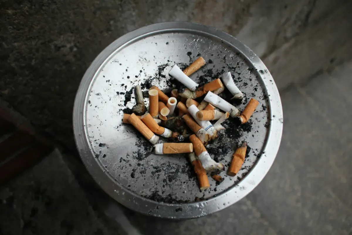 Ash tray full of cigarette butts