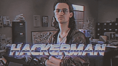 A meme gif of a stereotypical 1980s hacker with the caption, "Hackerman."