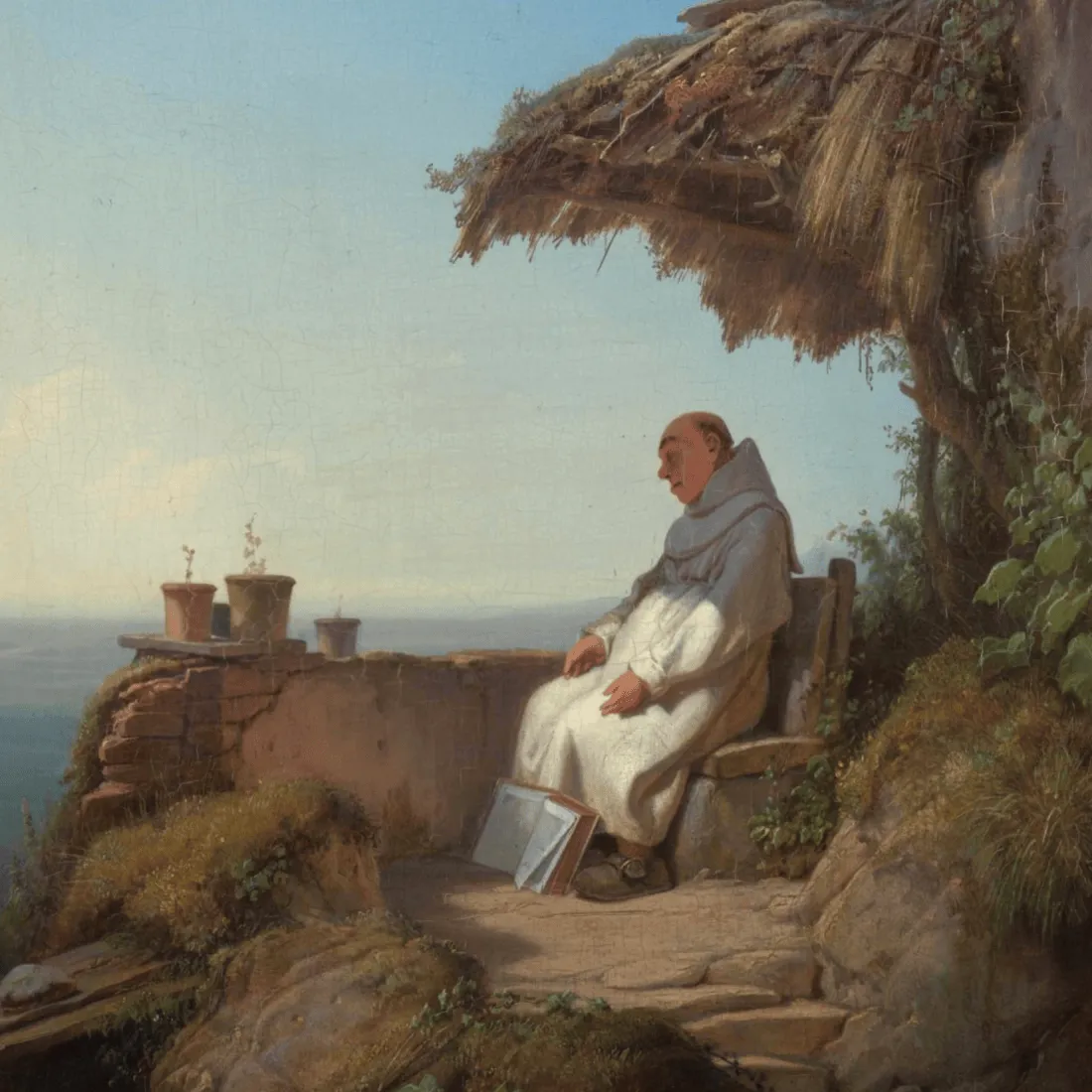 A monk dozes by the sea having dropped a book at his feet.