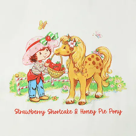 Classic 80s Strawberry Shortcake taking an apple from a basket of them held by Honey Pie Pony, both surrounded by butterflies