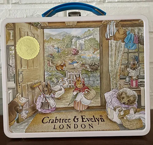 a vintage beautifully illustrated metal Peter Rabbit lunchbox
