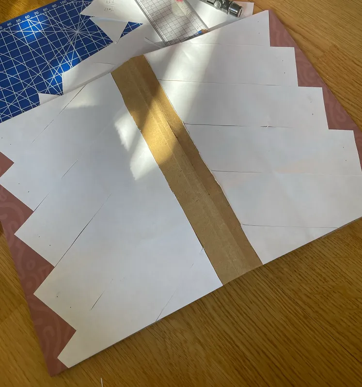 All paper parts attached, only the red thread is missing