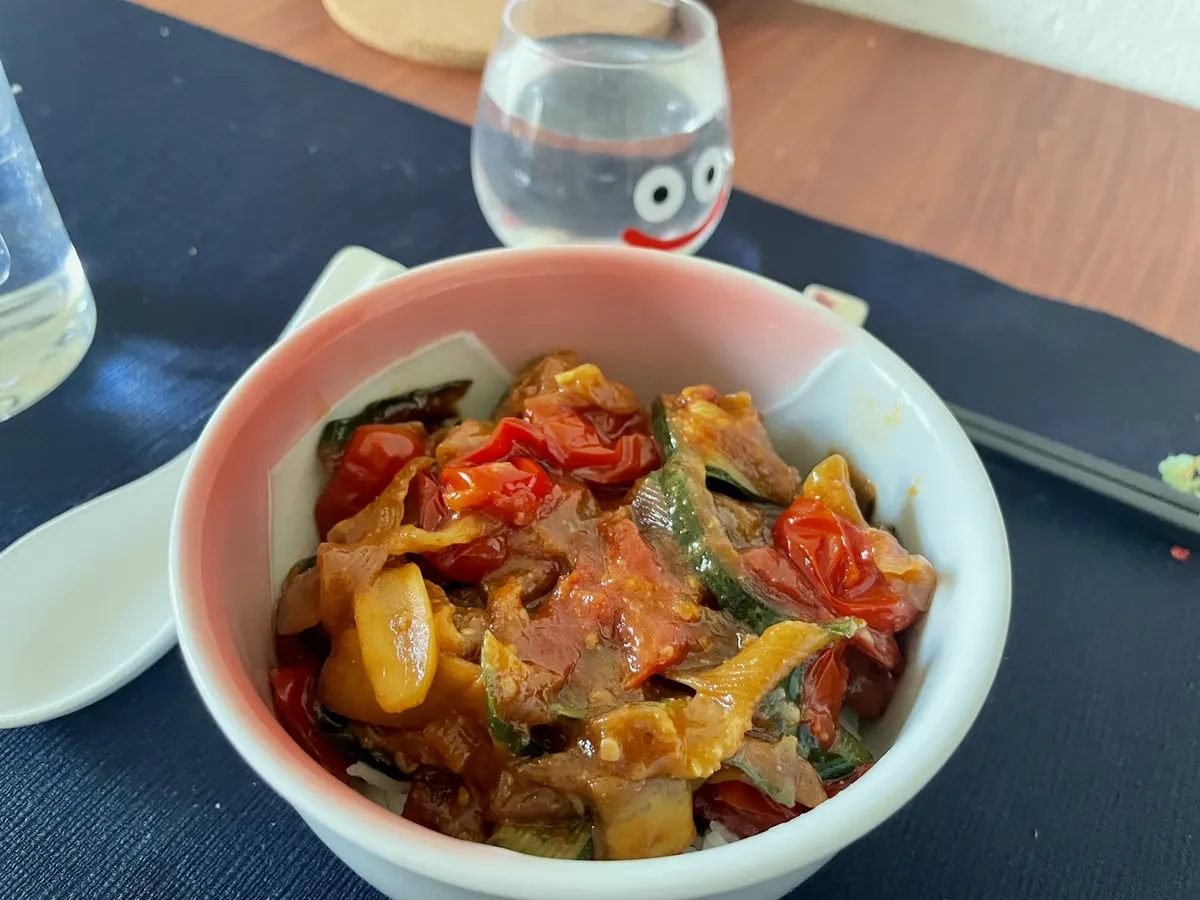 Zucchini and cherry tomatoes cooked with mostly soy sauce, sesame oil, miso and a couple spices, served on a bed of rice. Not too bad for something made to empty the fridge (02.10.26)