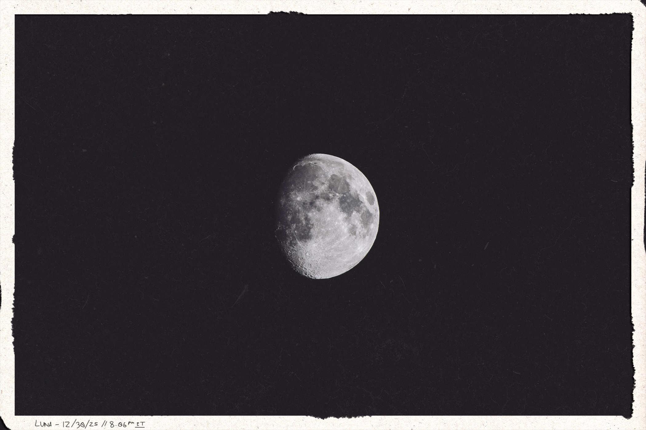 Framed photo of the moon, waxing gibbous; handwritten in the lower corner is 'Luna 12/30/25 // 8:06PM ET'