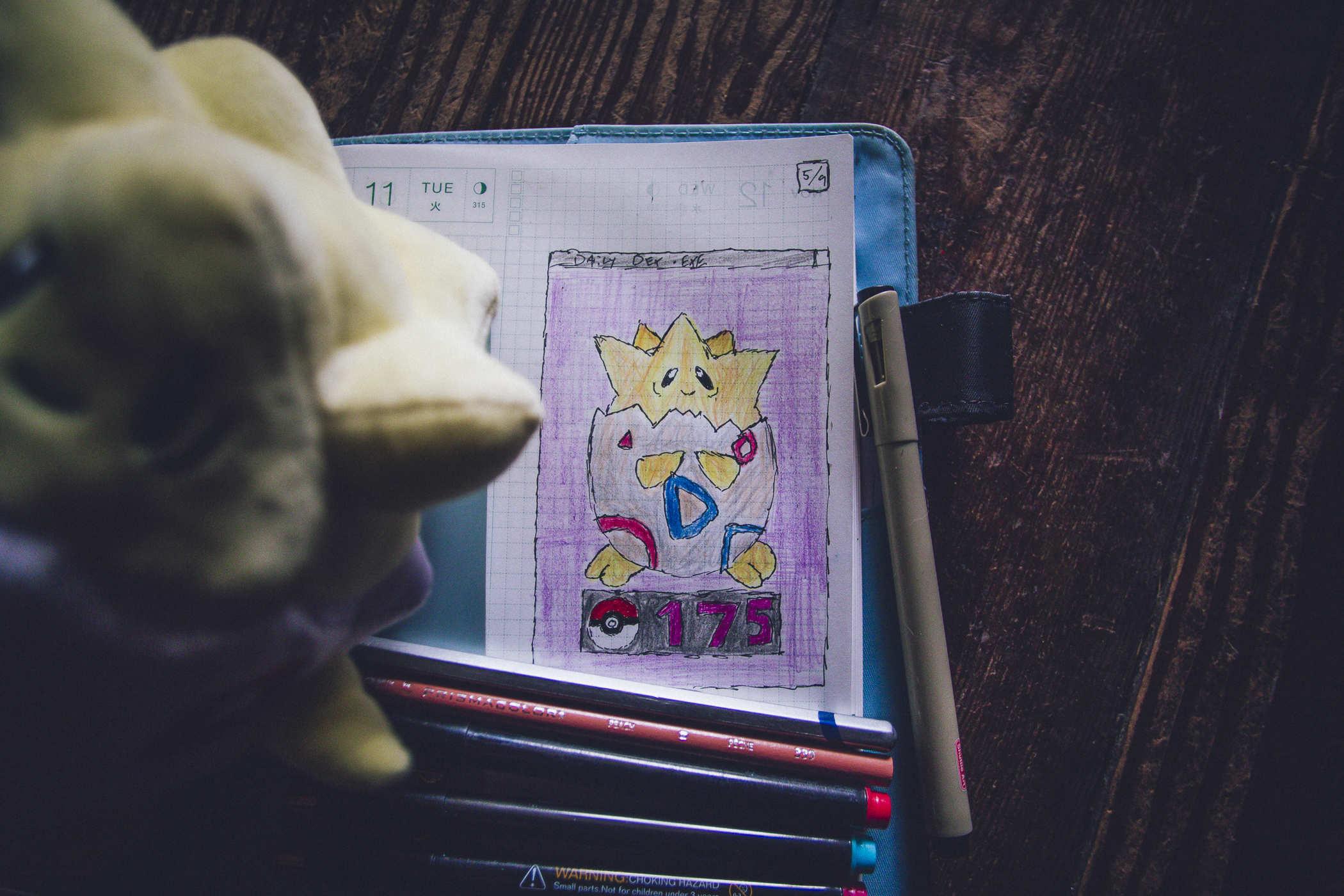 Drawing of pokemon 175 - Togepi, an egglike creature with blue and pink marks on the shell